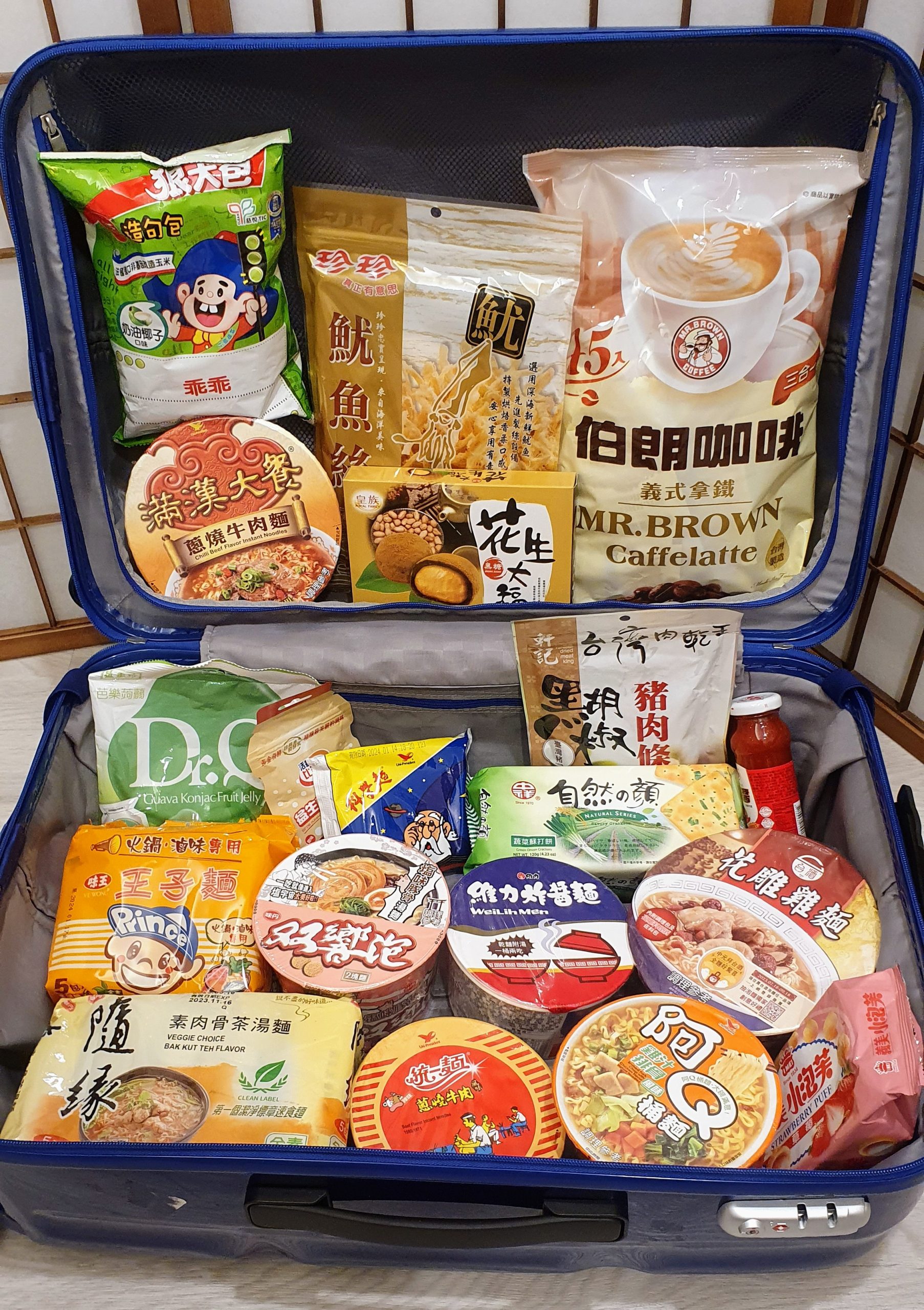 luggage filled with food from a taiwanese supermarket