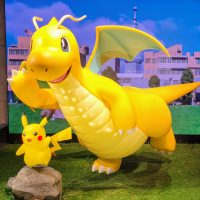 statues of pikachu and dragonite in the pokemon center in taipei